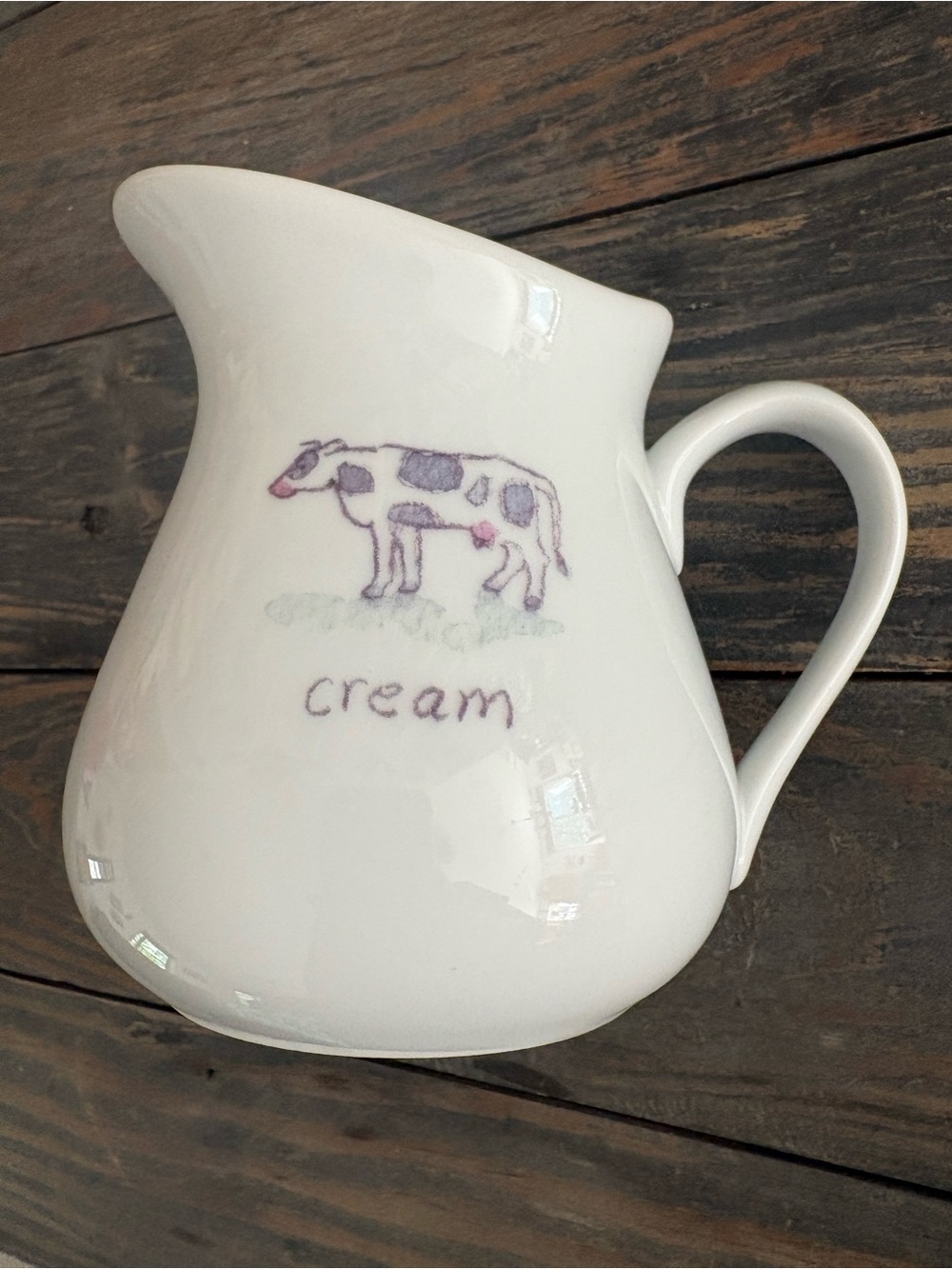 Cream-Colored Ceramic Creamer Pitcher with Cow Illustration